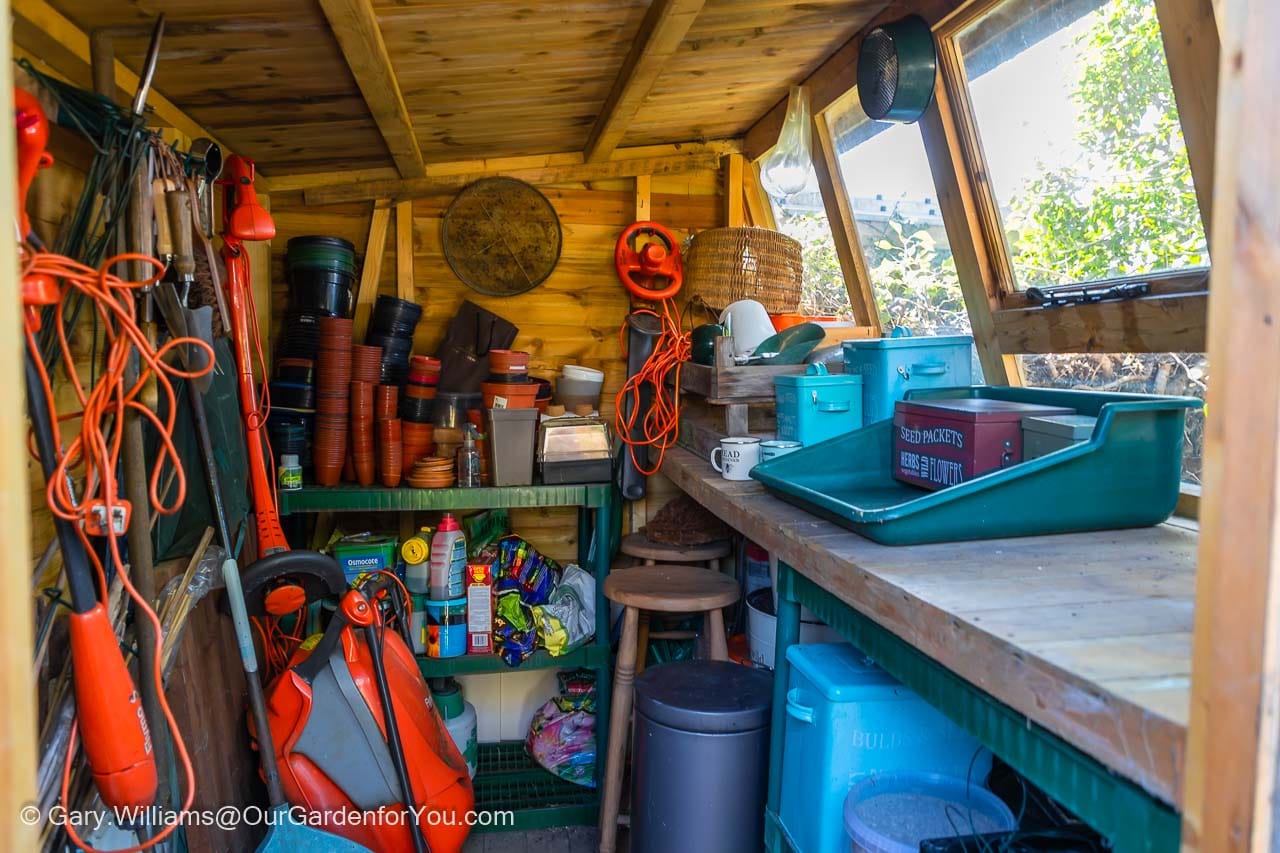 The inside of the potting shed after a spring clean and you can now see the worktop.