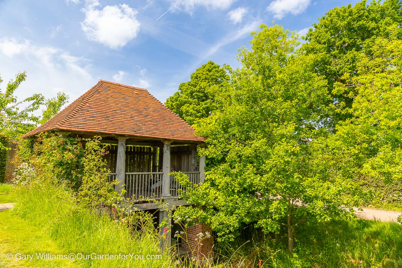 The boathouse with its red-tiled roof at Sissinghurst Castle Garden