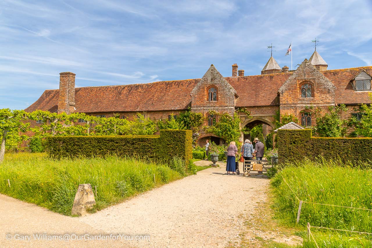 The gravel path leading to the red-brick Tudor entrance into Sissinghurst Castle Garden in Kent