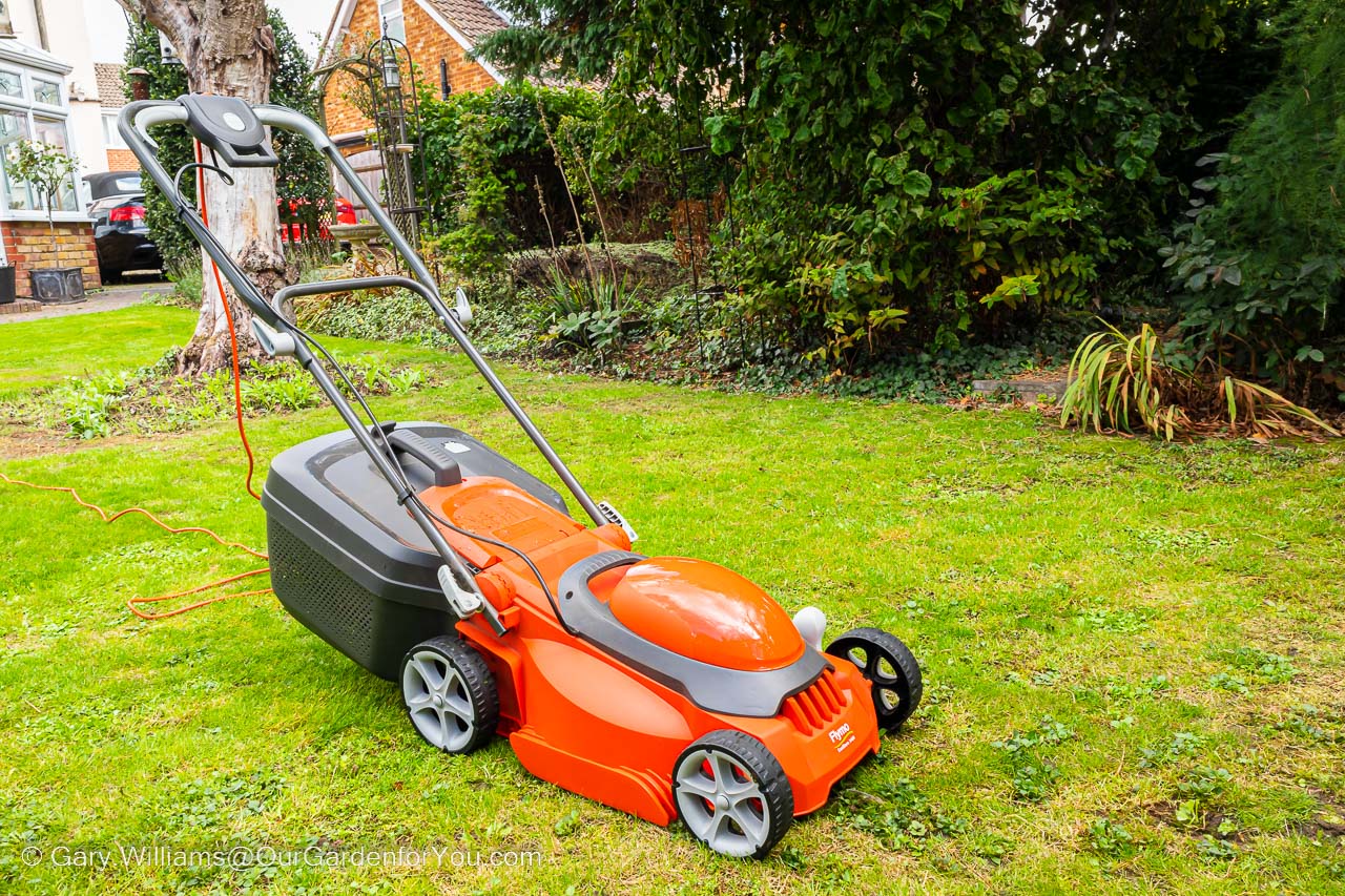 The Flymo EasiStore 340R lawn mower on the lawn