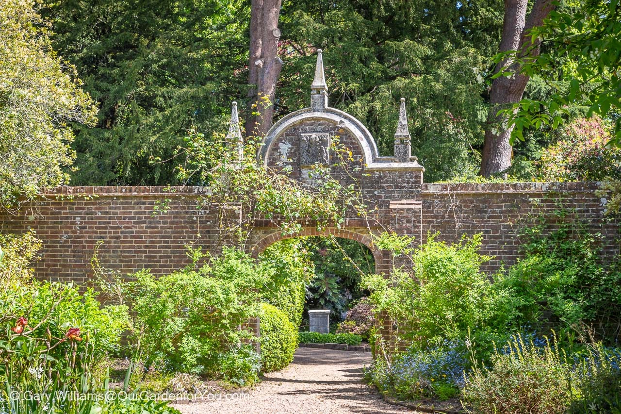 One of the entrance arches to the walled garden at nymans house and gardens in west sussex