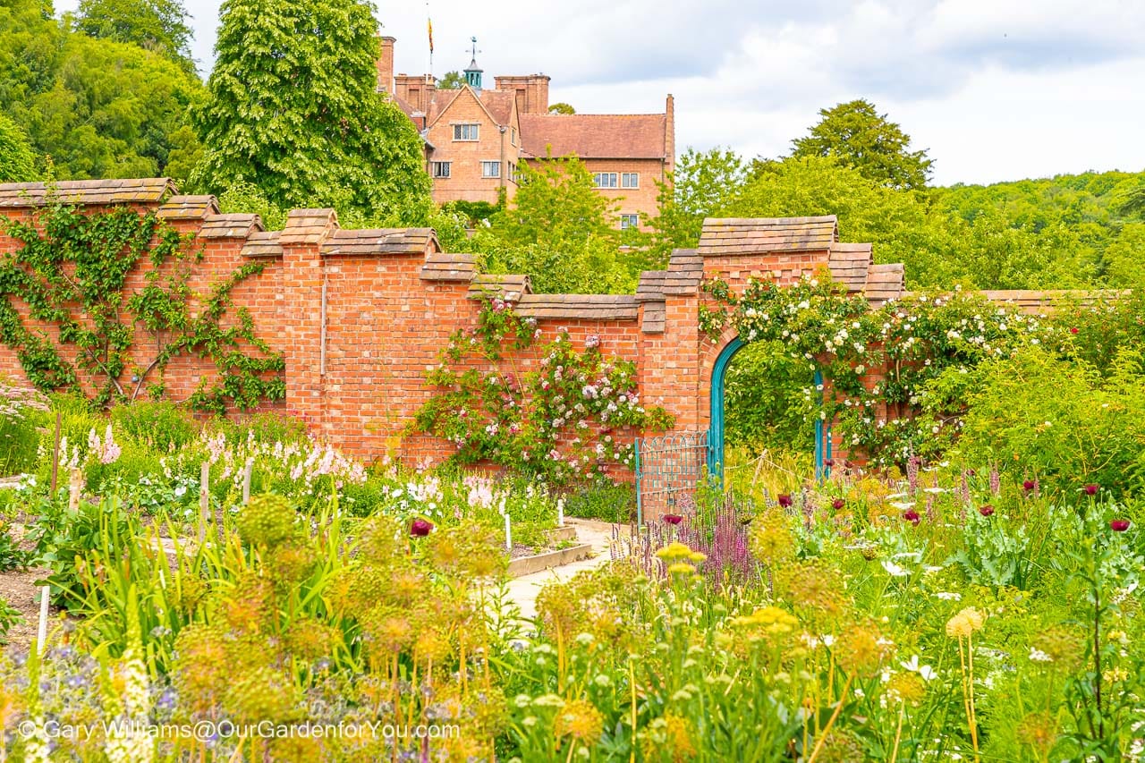 The view of chartwell house in westerham, kent, from the lower end of the walled garden on a summer's day