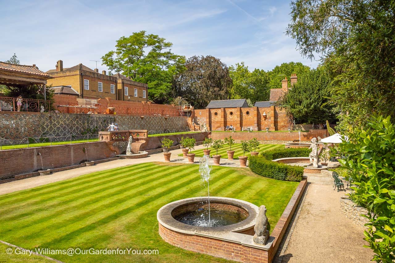 The beautifully restored formal gardens at Restoration House in Rochester, Kent, feature manicured lawns, elegant fountains, classical statues and historic brick walls. This peaceful hidden garden in the heart of historic Rochester offers a colourful glimpse into one of Kent’s lesser-known heritage attractions.